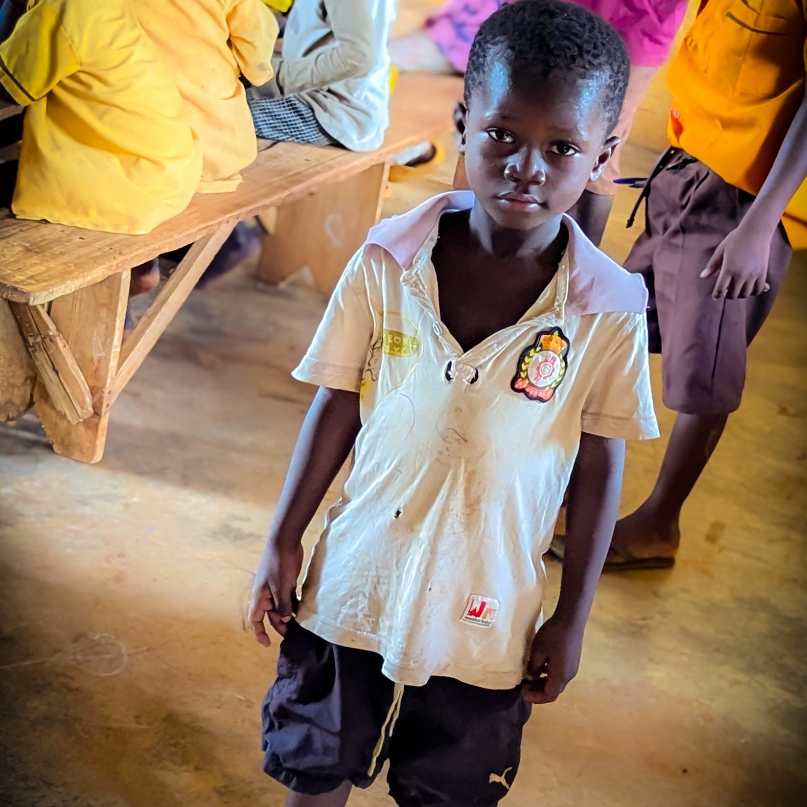A student standing in a classroom