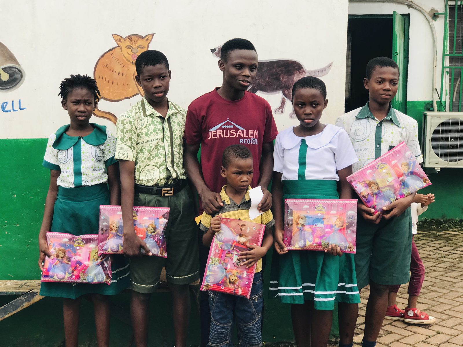 Children receiving school kits